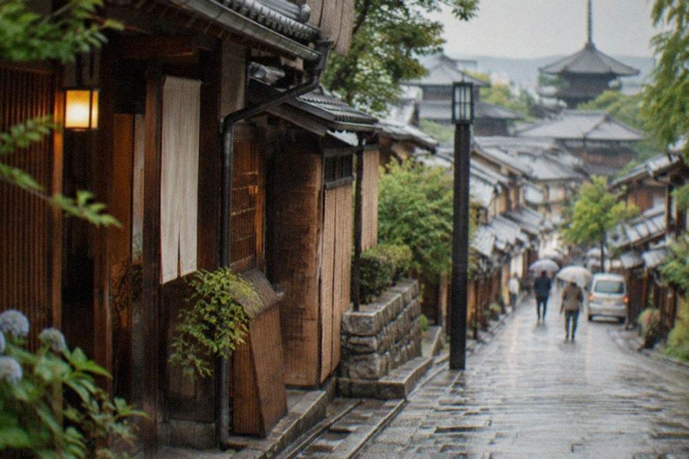 A quiet stone lane with traditional wooden machiya houses in Kyoto