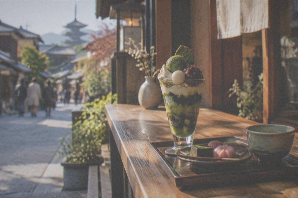 Green tea matcha parfait and traditional sweets served on a wooden counter in a Kyoto cafe