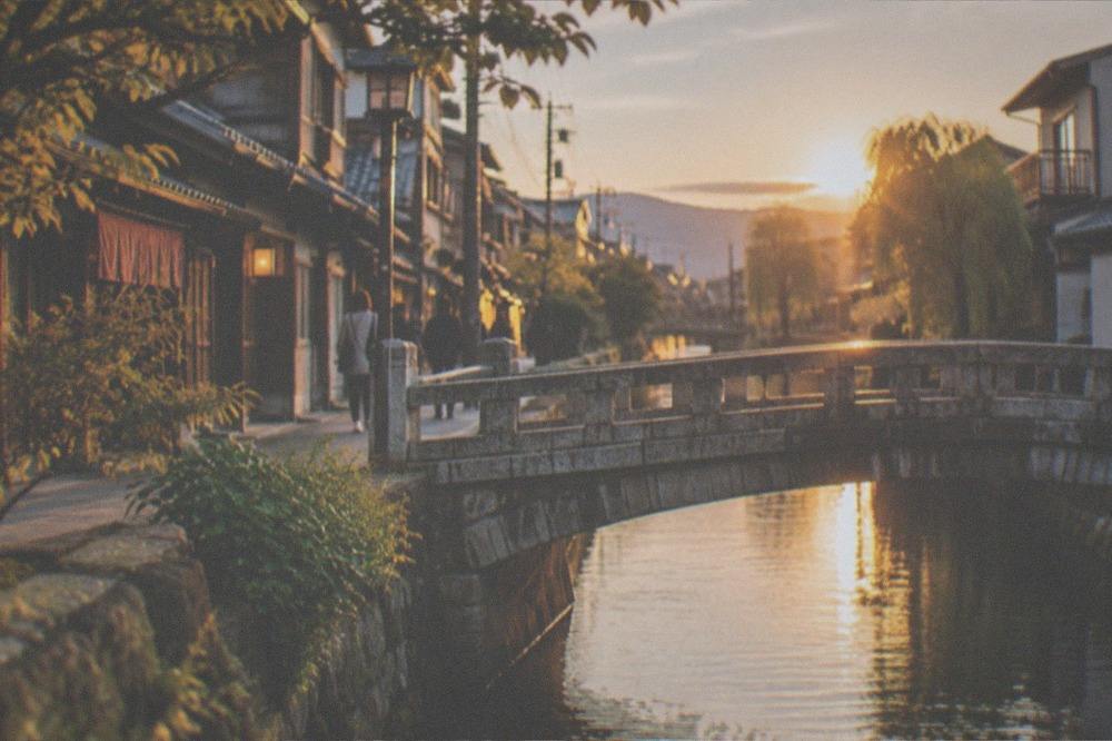 A stone bridge over a narrow canal in the Fushimi district
