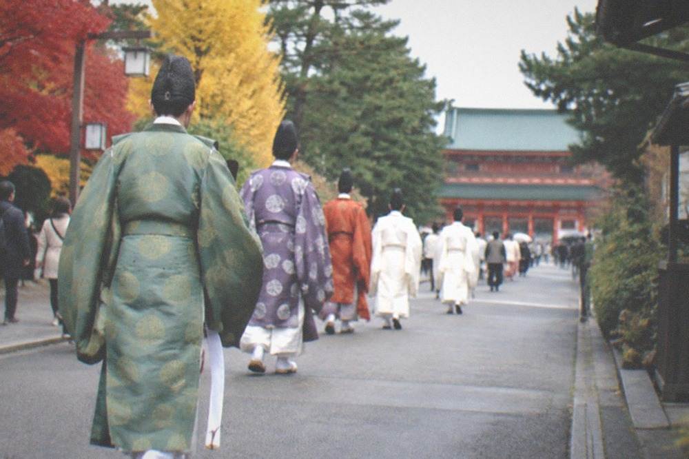 Costumed procession participants walking toward Heian Shrine during Jidai Matsuri