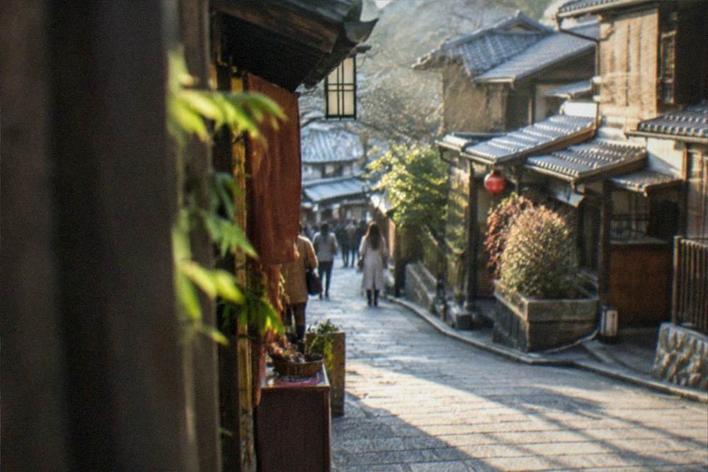 Stone-paved sloping lanes with traditional wooden shopfronts in Higashiyama, Kyoto