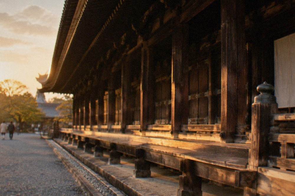 The long veranda of a wooden temple hall stretching into the distance under a broad tiled roof