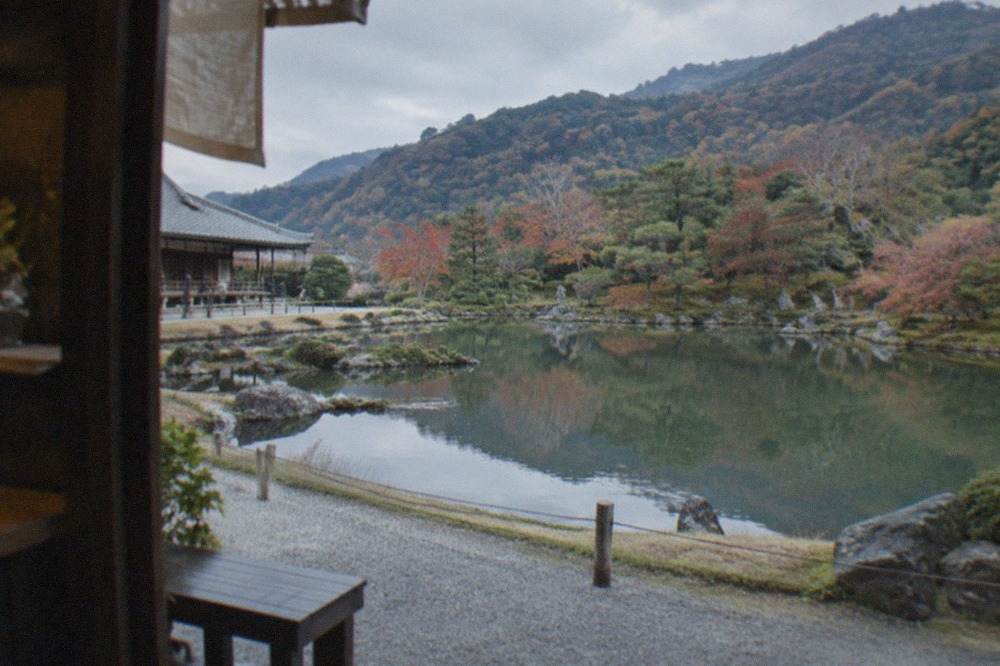 The Sogenchi pond garden at Tenryu-ji with the Arashiyama hills behind it
