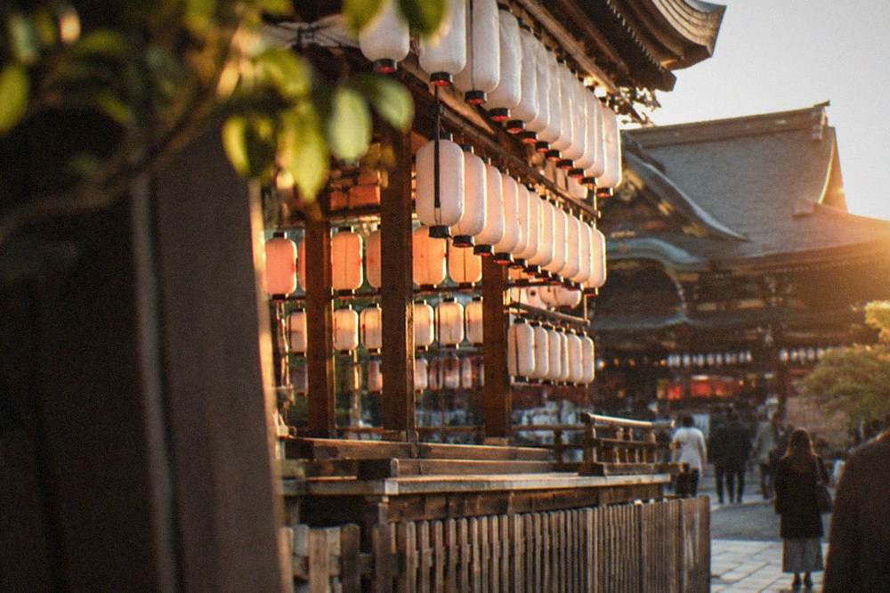 Rows of paper lanterns hanging from the dance stage in front of the Yasaka Shrine main hall