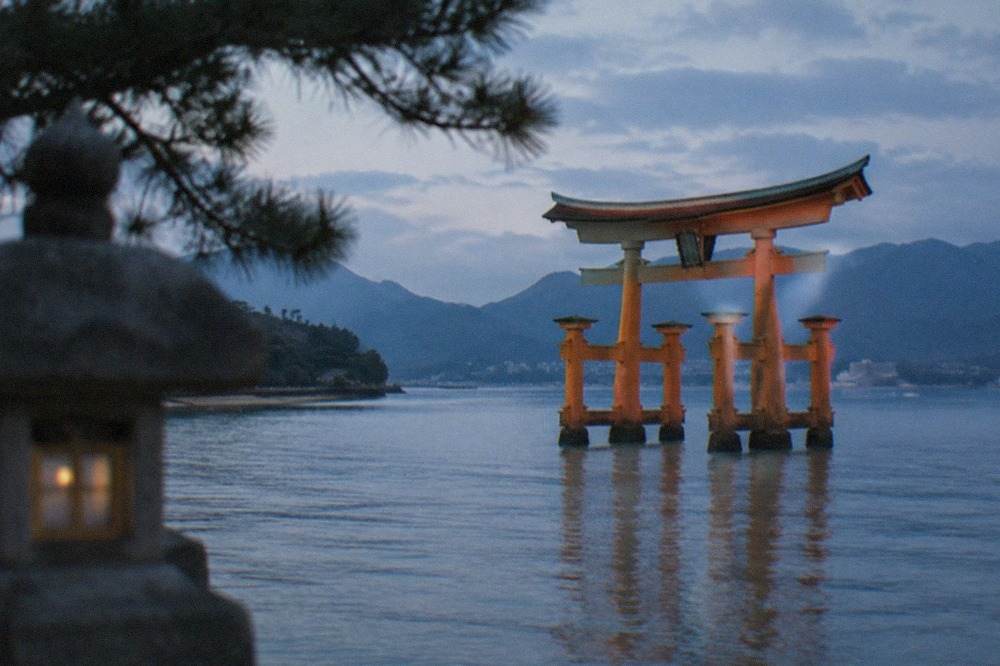 The floating torii gate of Itsukushima Shrine rising from the water at Miyajima