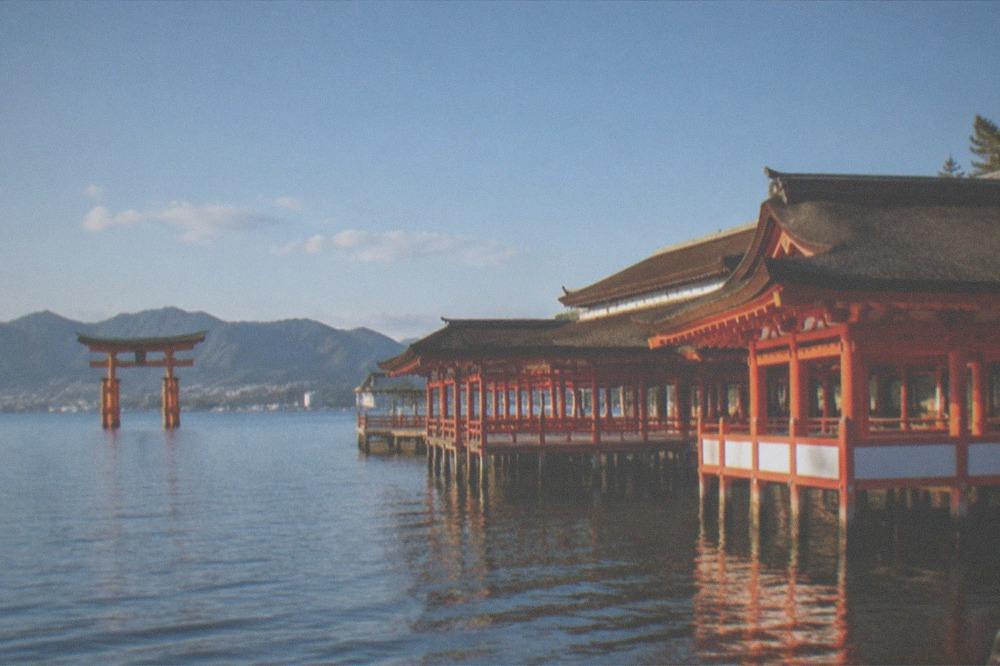 Itsukushima Shrine's vermillion buildings extending over the water at Miyajima