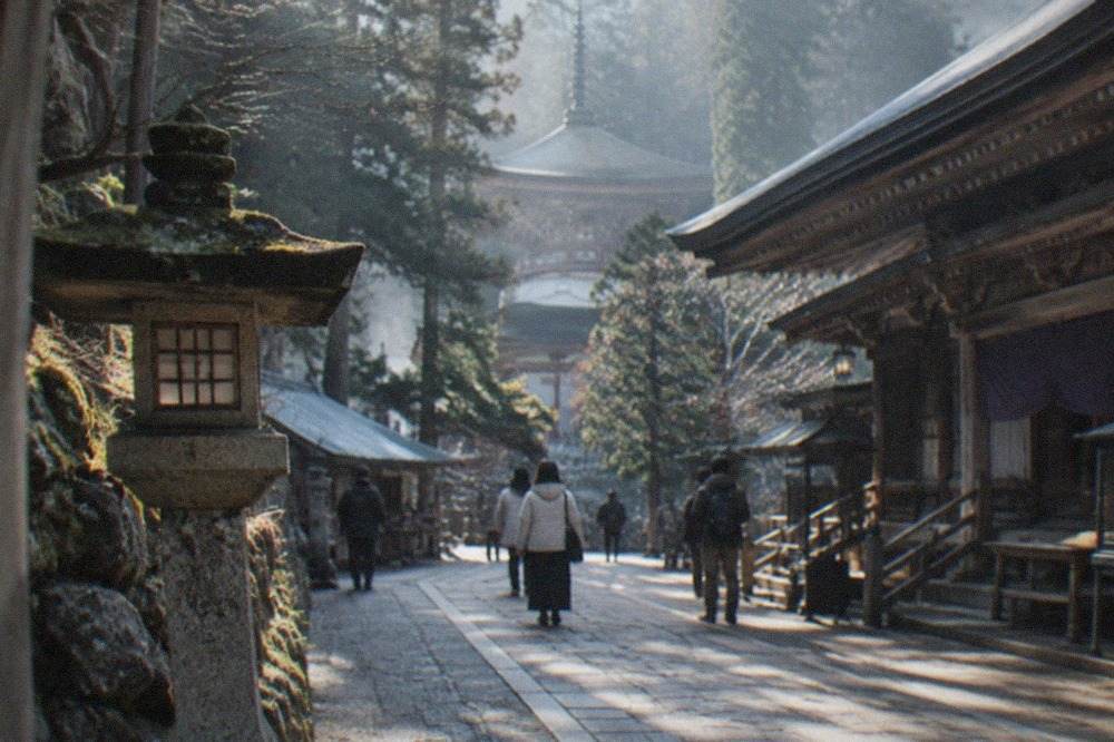 Mountain temple complex with wooden halls and mist among cedar trees