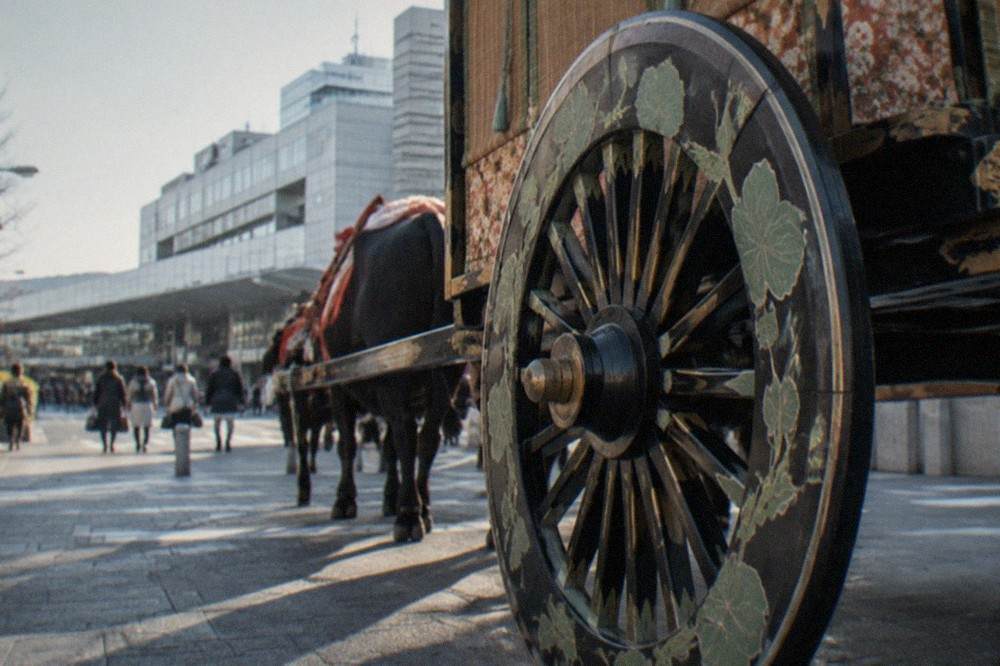 Heian court ox cart with large wooden wheels decorated with hollyhock leaves