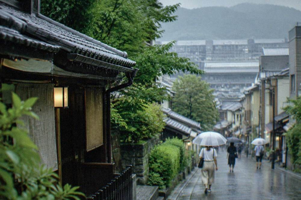 Rain falling on the tiled roof of a Kyoto street in summer