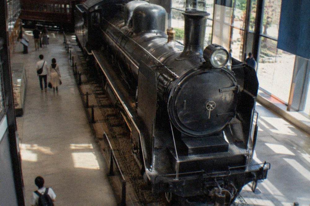 Steam locomotive displayed in a railway museum hall