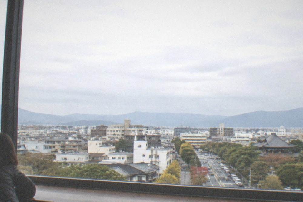 Observation deck interior with city views through large windows