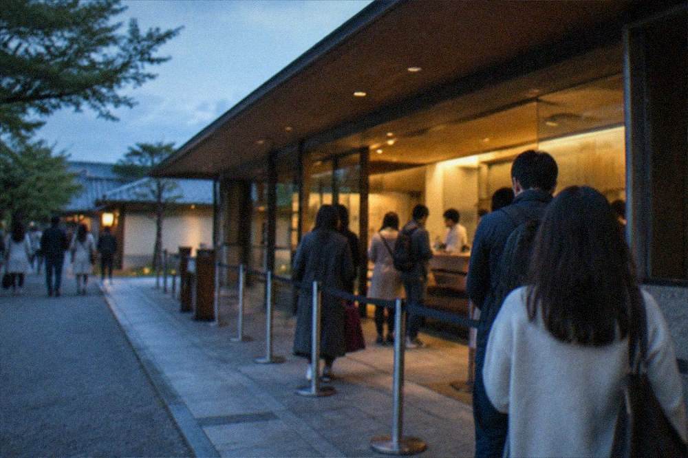 Museum ticket counter with visitors queueing at entry