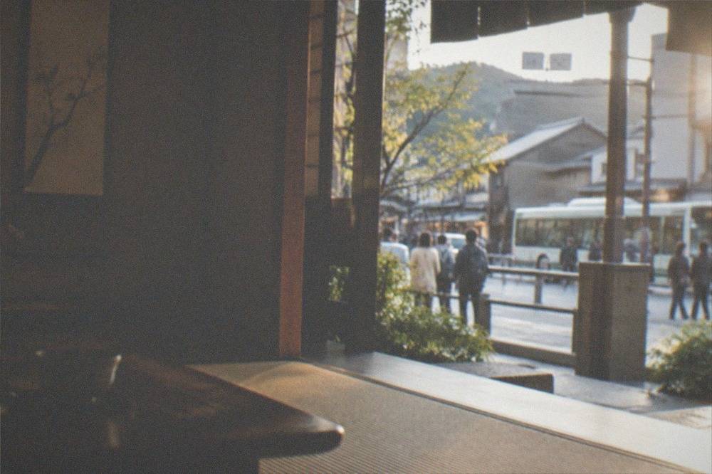 A temple tea room with tatami mats and a hanging scroll