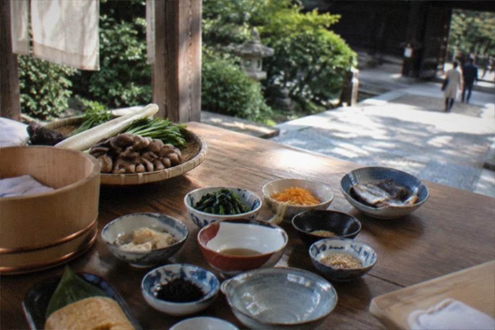 A cooking class table with ingredients for a washoku meal laid out in small bowls