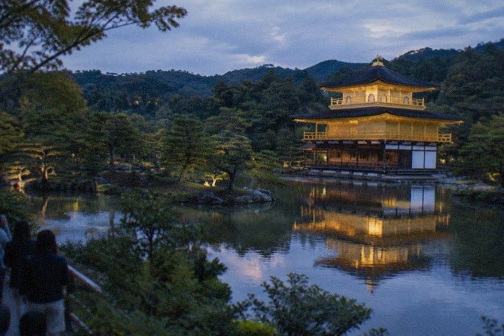 Golden pavilion of Kinkaku-ji reflected in the pond in front of it