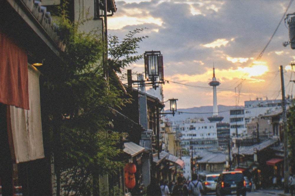 Evening light over the rooftops of central Kyoto with the station tower in the distance