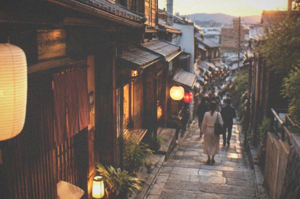 A narrow alley of small bars with warm light spilling onto the paving