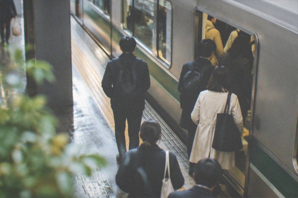 Commuters boarding a subway train on the Karasuma line at Kyoto Station
